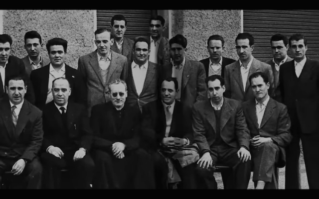 a group of men posing for a photo