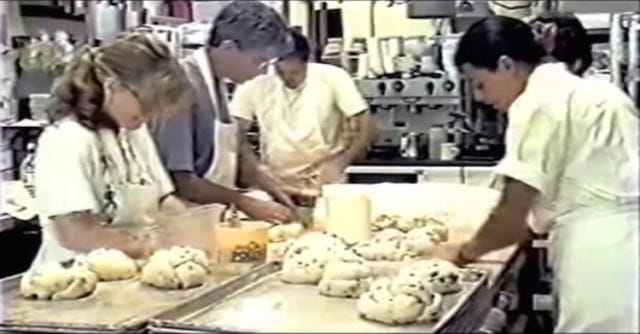 a group of people working in a kitchen