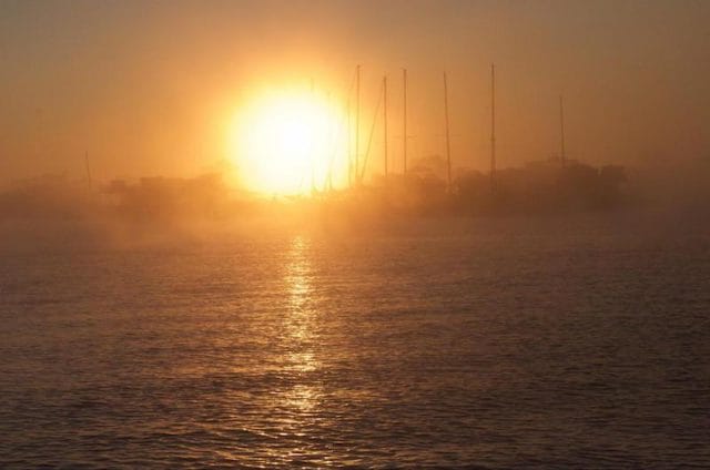 a sunset over a body of water