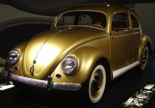 a gold car on display