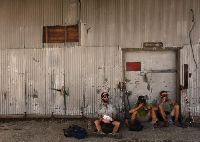 a group of people sitting outside a building