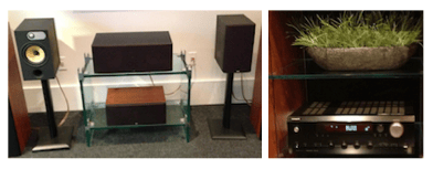 a group of speakers and a plant