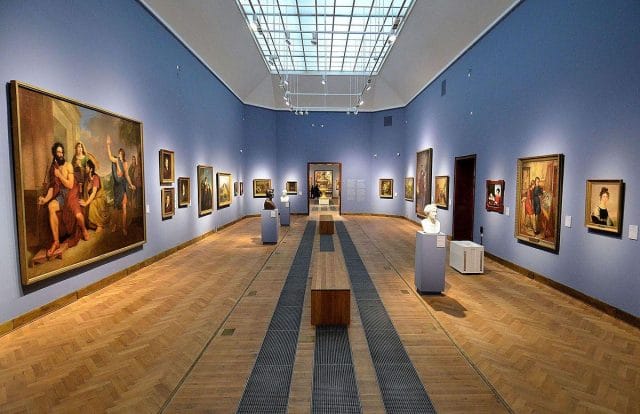 a large room with art on the walls