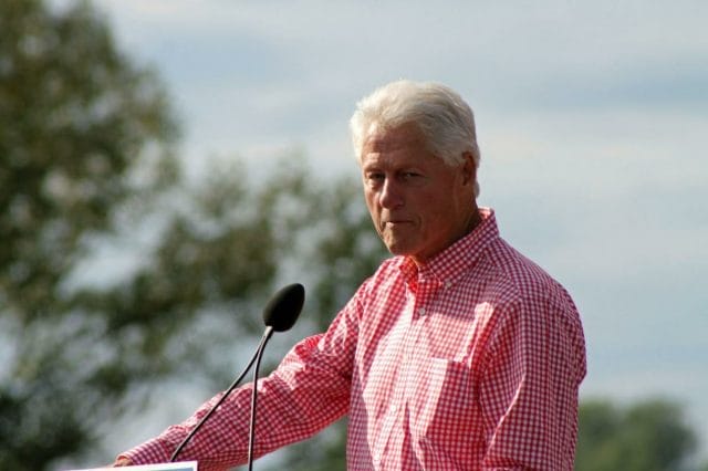 Bill Clinton speaking into a microphone