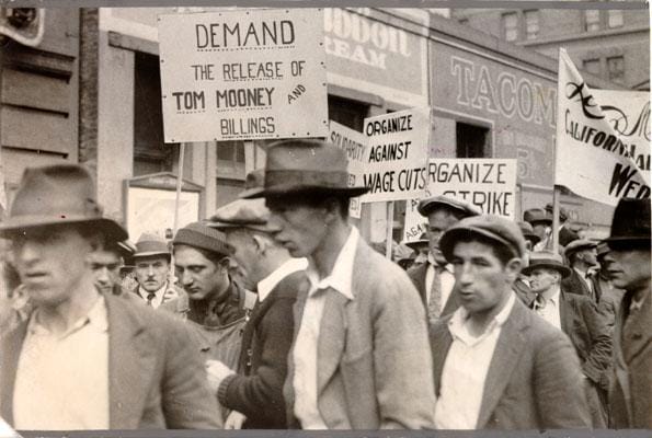 a group of people holding signs