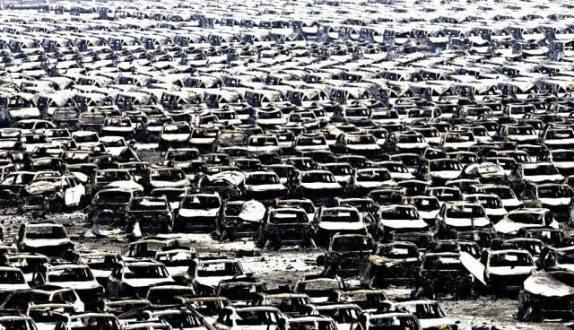 a large group of cars parked in a parking lot
