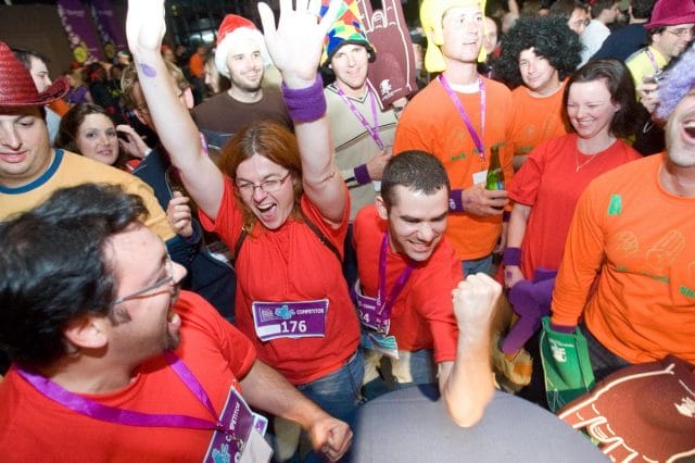 a group of people wearing red shirts