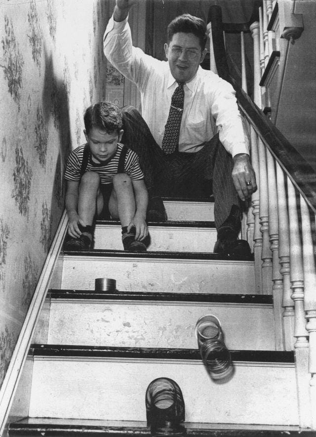 a person and a boy climbing a staircase