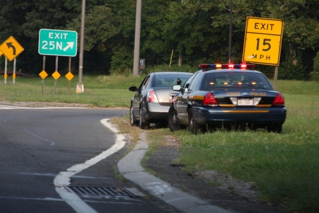 a police car and a police car on a road