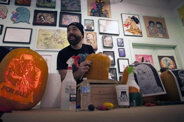 a person holding a pumpkin