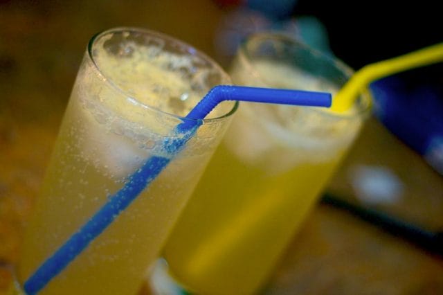 a glass with a blue liquid in it