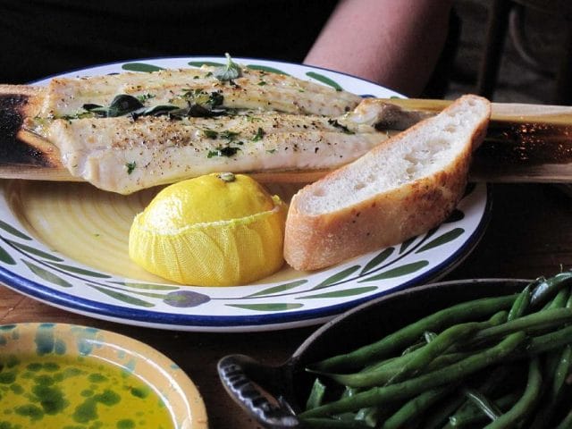 a plate of fish and vegetables