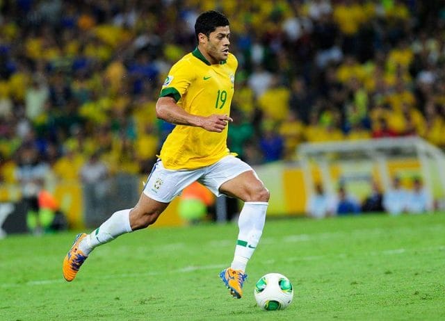 Givanildo Vieira de Souza in a yellow shirt playing football