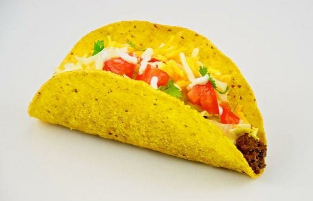 a taco with meat and vegetables