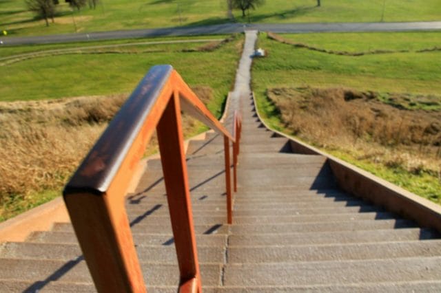 a wooden bridge over a road