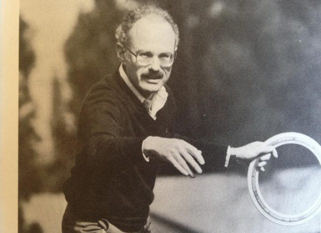 a man holding a tennis racket