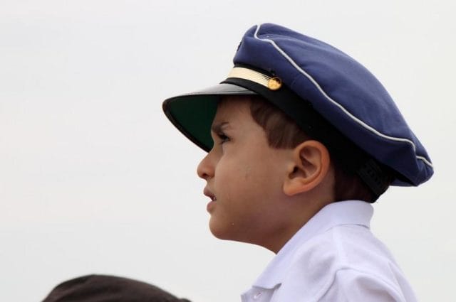 a boy in a blue hat
