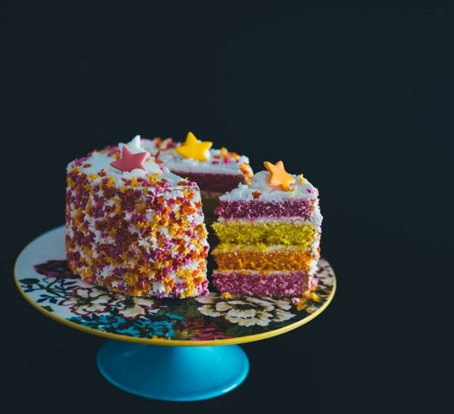 a plate of colorful cakes