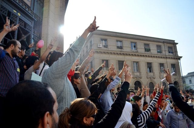 a group of people raising their hands