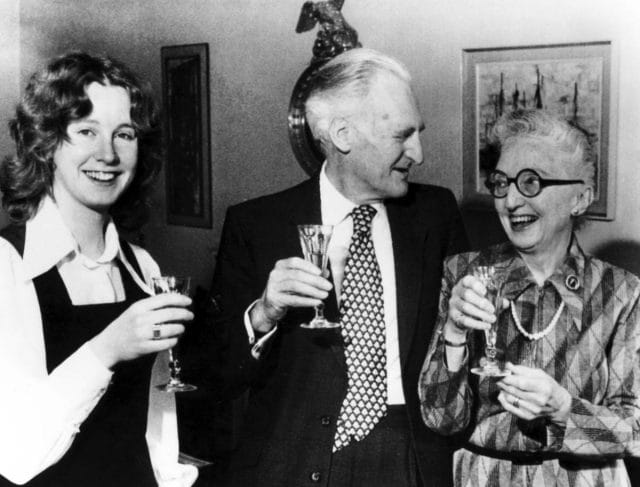 a group of people holding wine glasses