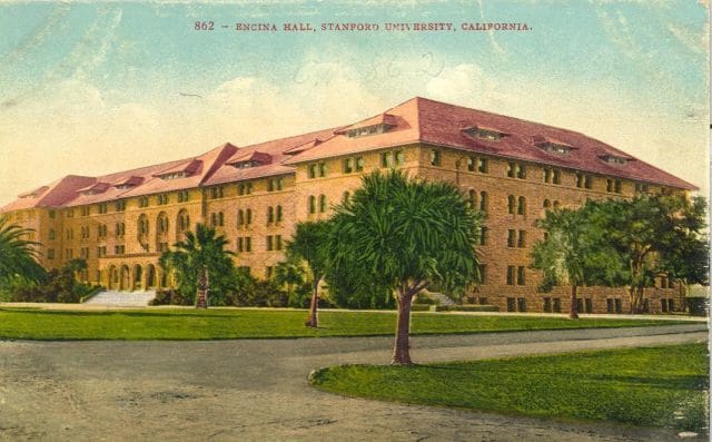 a building with palm trees in front