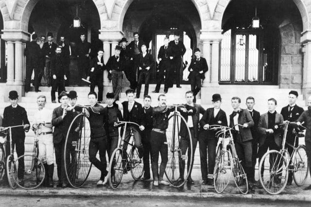 a group of people in military uniforms with bicycles