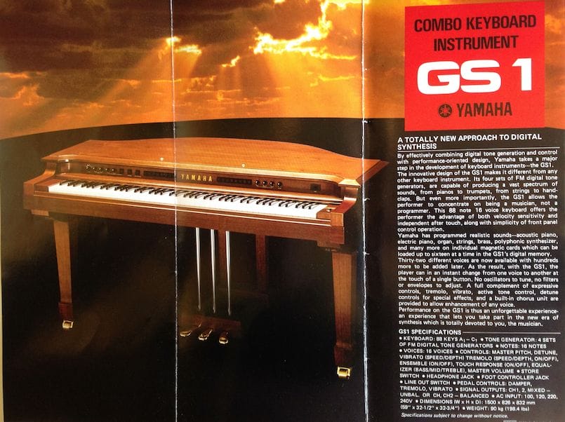 a piano with a sign on the side