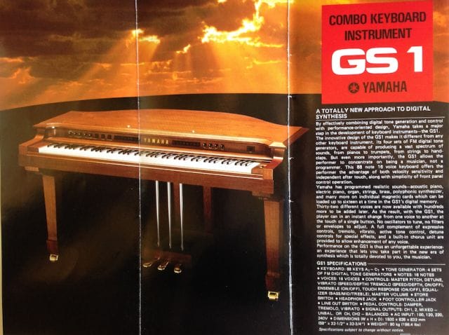 a piano with a sign on the side