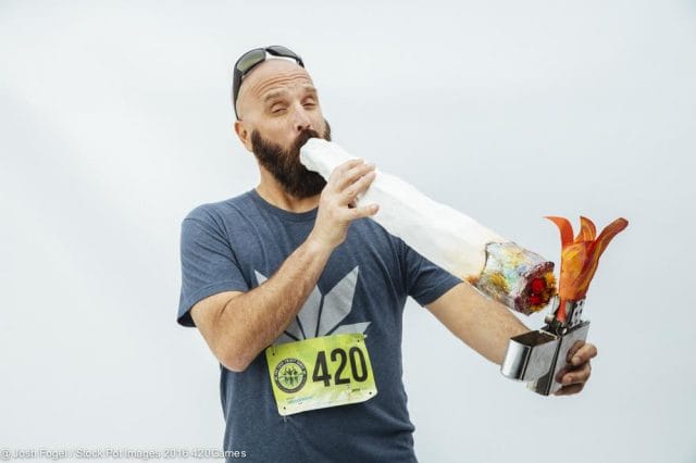 a man holding a fire extinguisher and a can