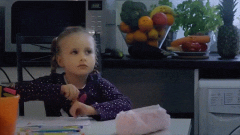 a child sitting at a table