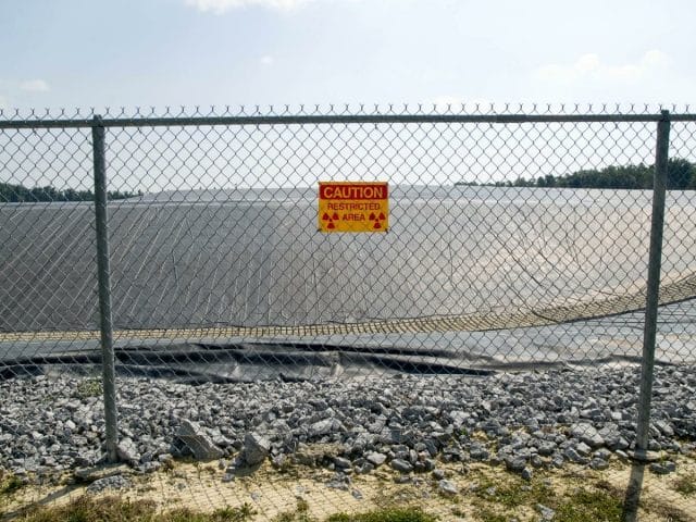 a sign on a fence
