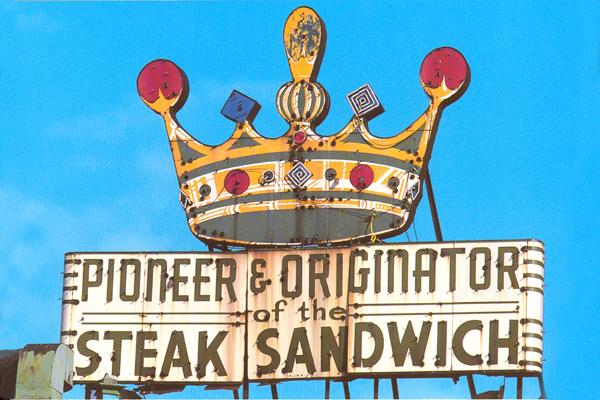 a sign with a crown on top