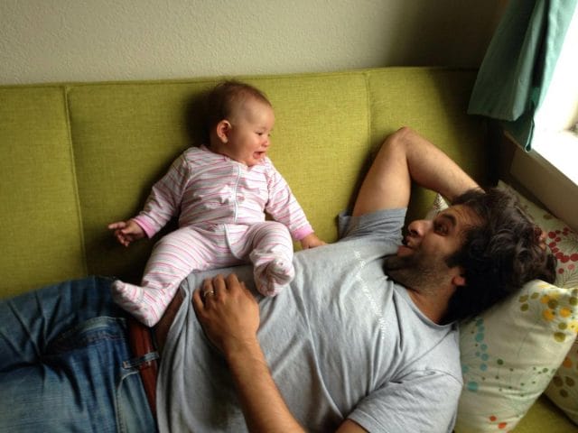 a man and a baby on a couch