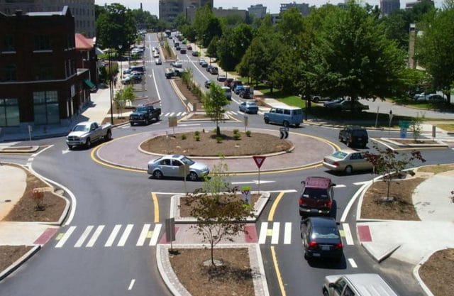 a street with cars and trees