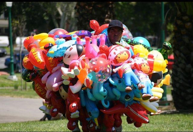 a person with a bunch of balloons