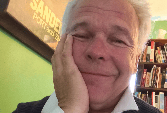 a man with his hand on his face