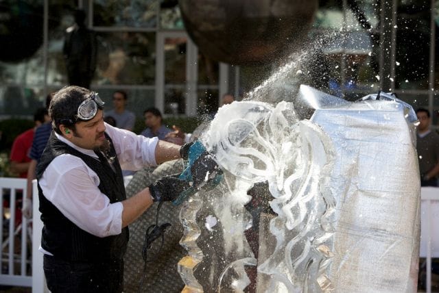 a man pouring water into a plastic bag
