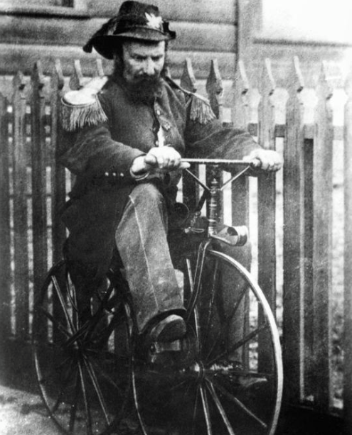 a man sitting on a bicycle