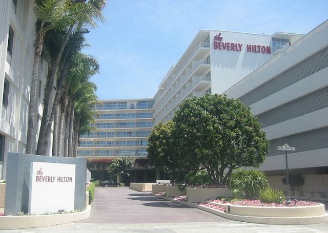 The Beverly Hilton with a sign in front