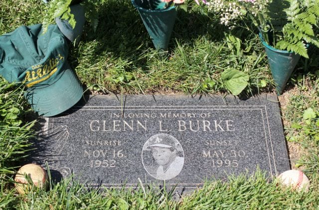 a grave stone in a garden