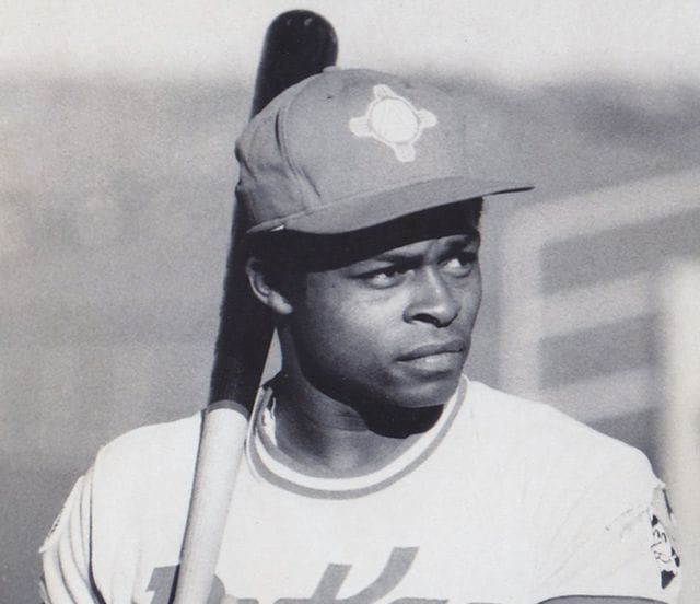 Glenn Burke wearing a baseball hat