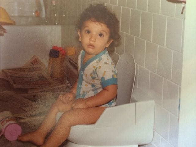 a baby sitting in a high chair