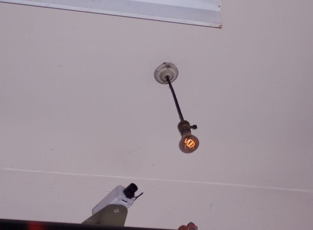 a ceiling fan with a light fixture