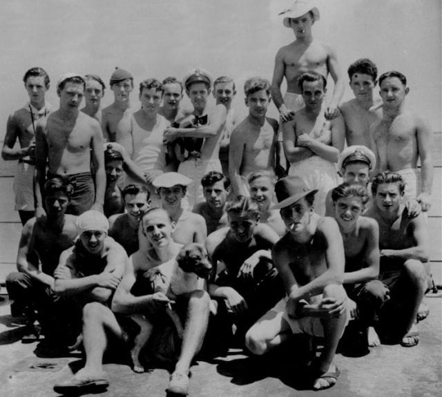 a group of men posing for a photo
