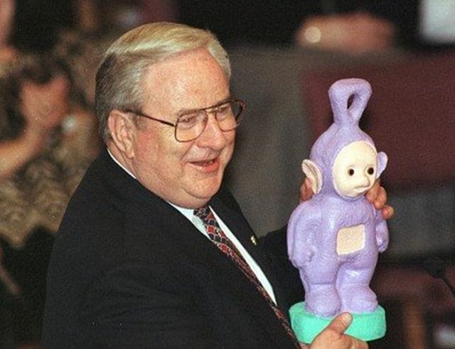 Jerry Falwell holding a stuffed animal
