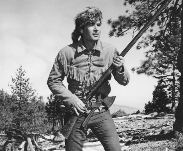 Fess Parker holding a guitar