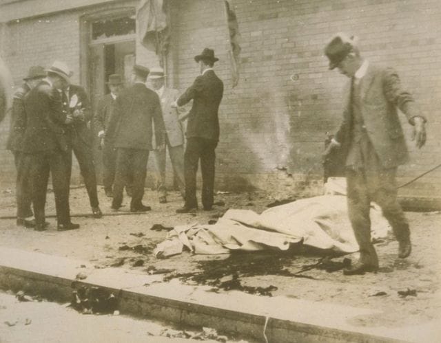 a group of men standing outside a building