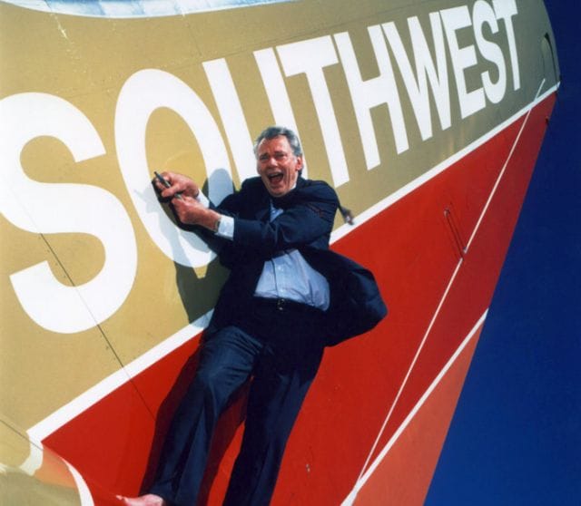 Herb Kelleher holding a microphone