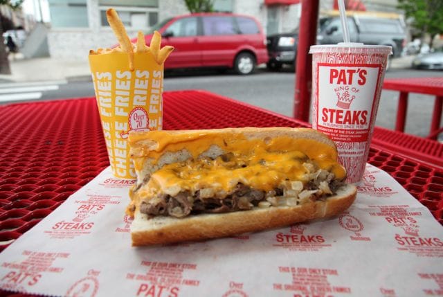 a sandwich and a drink on a table