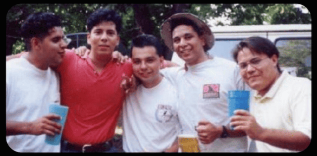 a group of men posing for a photo
